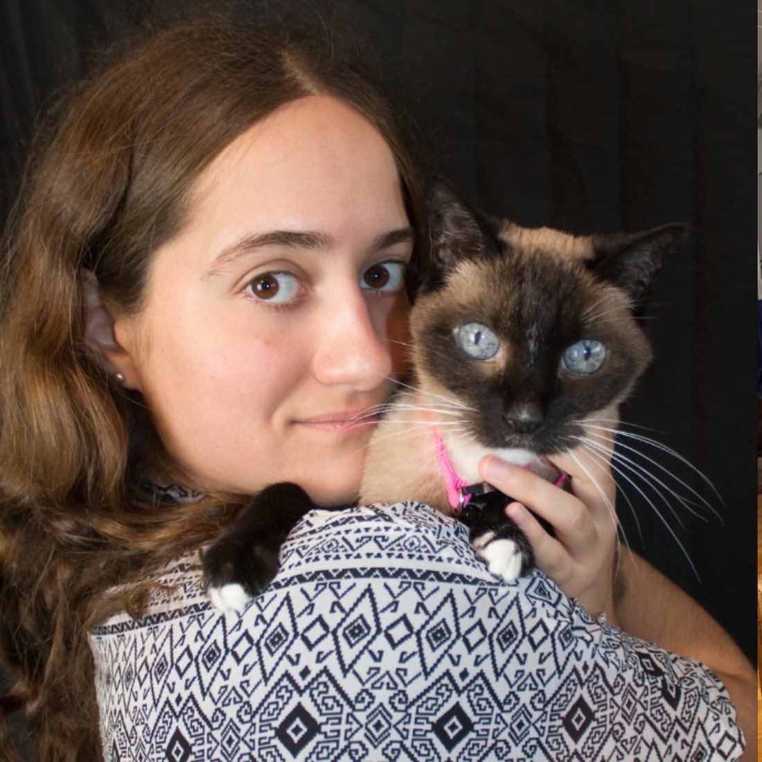 Lyndsay holding a Siamese cat